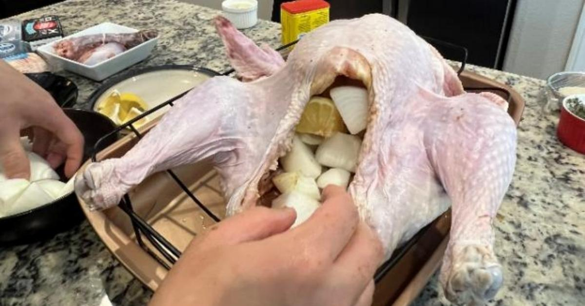 Place onions, lemon wedges, and the herbs sachet into the cavity of the turkey