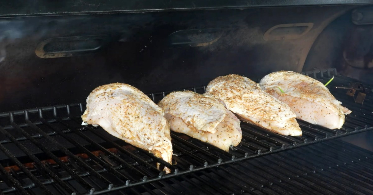 Place the chicken breast into the smoker