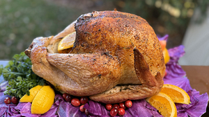 Golden smoked turkey with crispy, flavorful skin for Thanksgiving